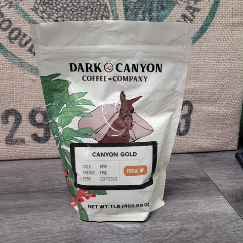 Dark Canyon Coffee Company Canyon Gold coffee package on a textured surface
