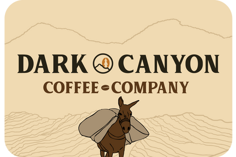 dark canyon coffee horizontal logo with mountains and donkey 3 inch by 2 inch matte sticker