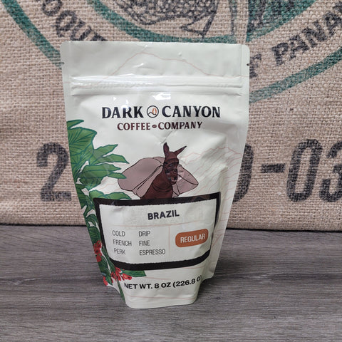 brazil coffee half lb package from Dark Canyon Coffee Company on a rustic background