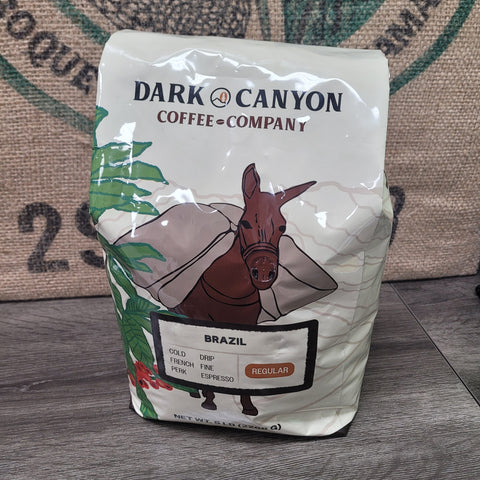 Brazil 5lb Coffee package from Dark Canyon Coffee Company on a wooden surface