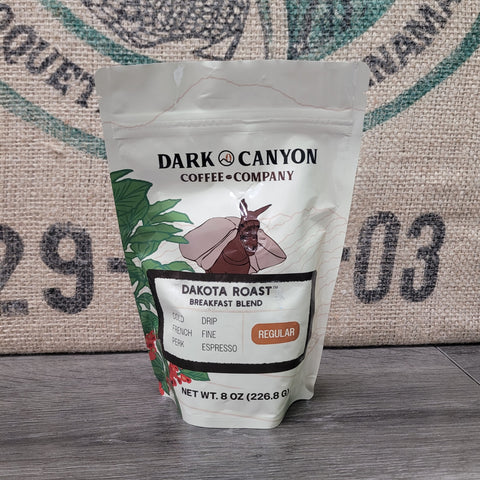 Coffee bag from Dark Canyon Coffee Company on a rustic background