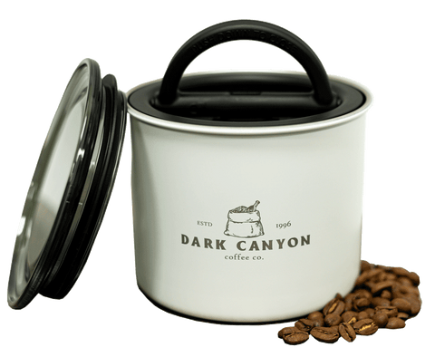 dark canyon coffee white half pound airscape container open with lid and beans