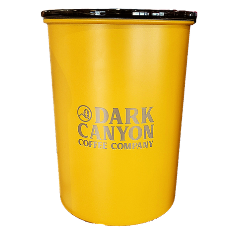 yellow one pound ariscape coffee canister with dark canyon logo engraved