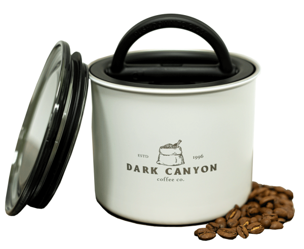 dark canyon coffee white half pound airscape container open with lid and beans