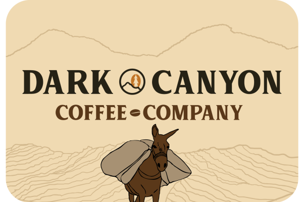 dark canyon coffee horizontal logo with mountains and donkey 3 inch by 2 inch matte sticker