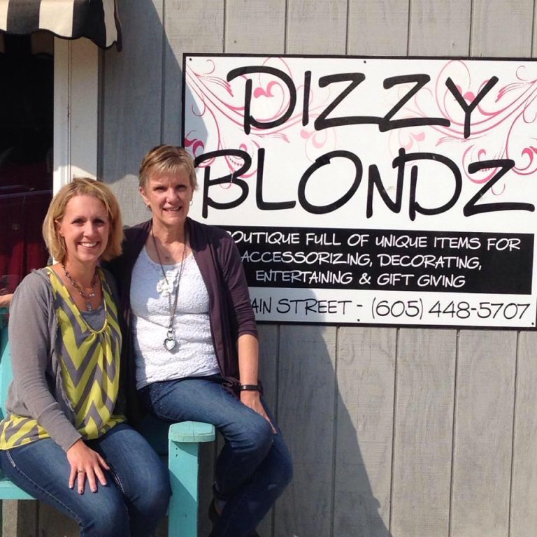 dizzy blondz store sign and owners 768x768